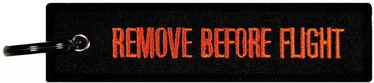 Μπρελόκ Λογότυπο Remove Before Flight Υφασμάτινο Μαύρο